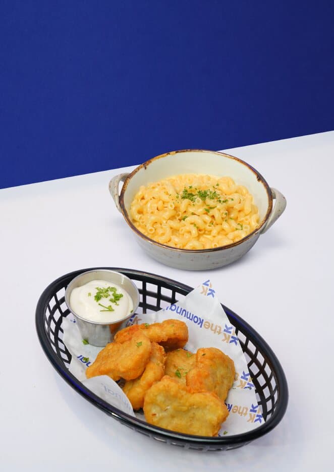 Mac and cheese and a basket of tempura nuggets with dip
