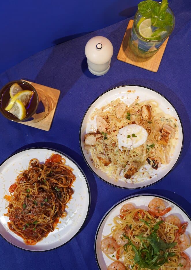 Plates of beef bolognese, scampi olio and chicken almond alfredo
